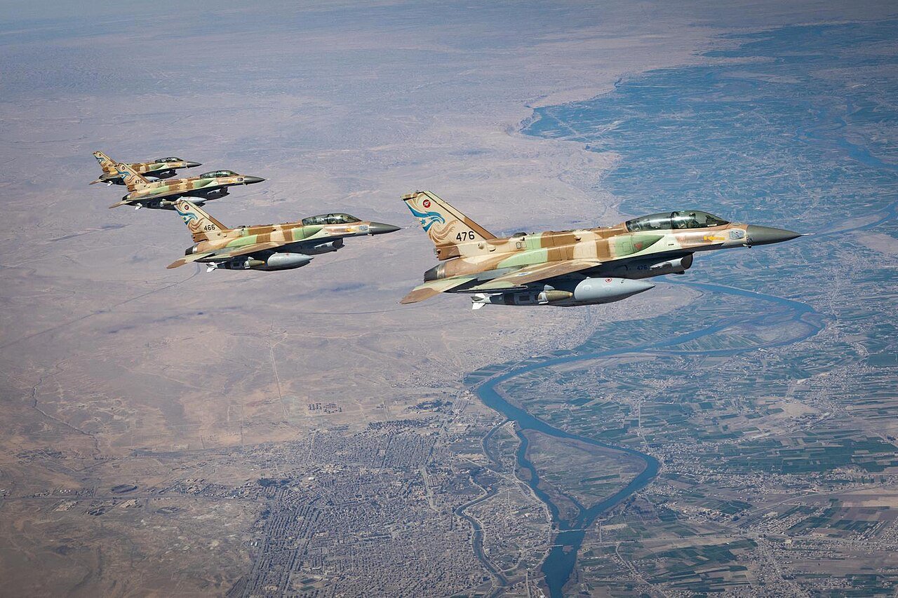 Fighter jets flying over desert during military operation