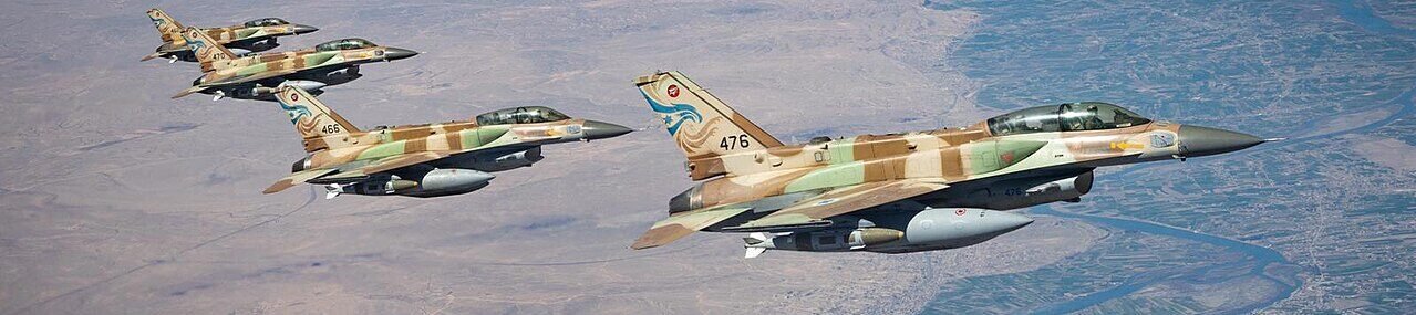 Fighter jets flying over desert during military operation